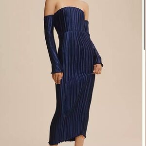 L’Idee navy pleated strapless dress with removable off the shoulder sleeves.